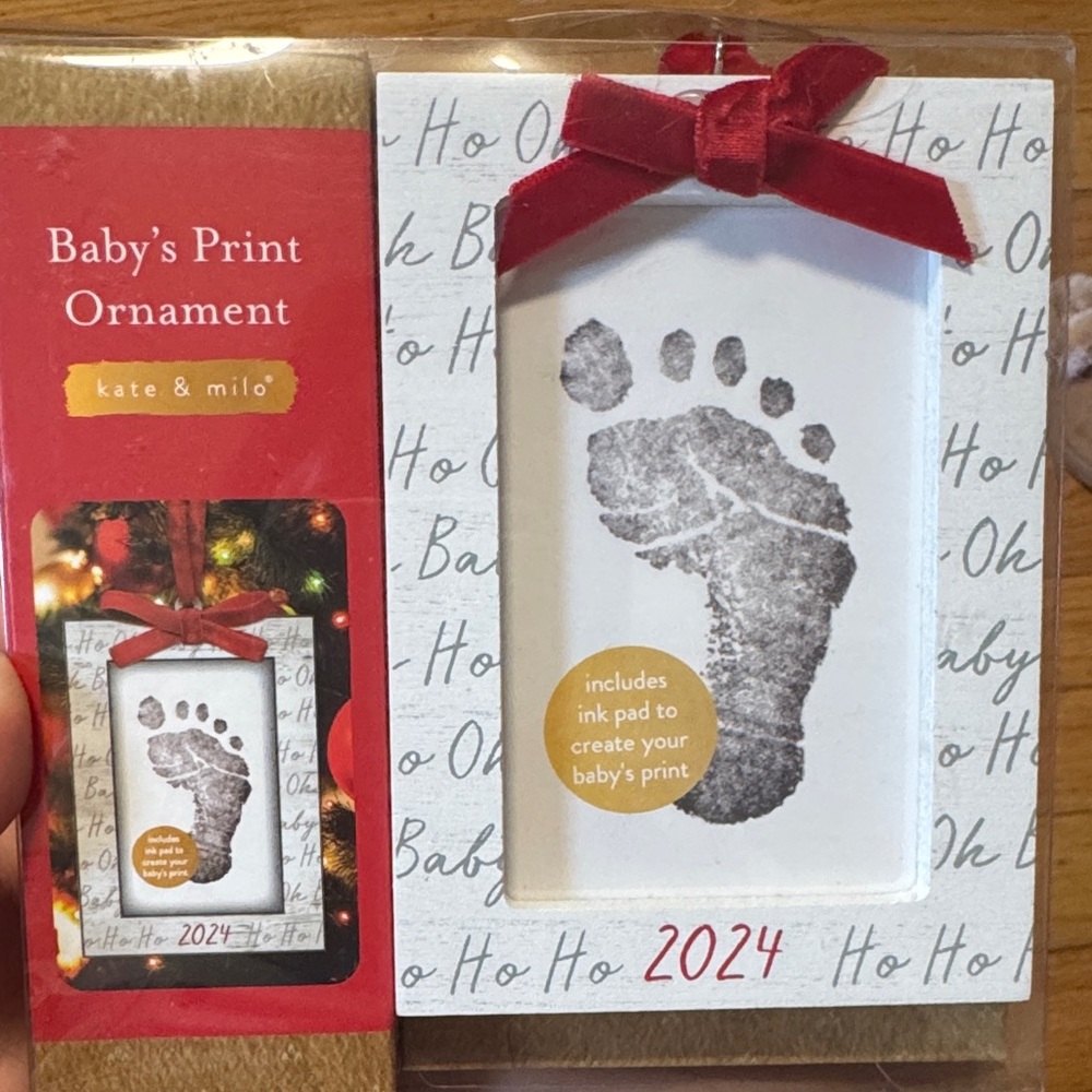 Baby's Print Ornament with Red Bow 2024